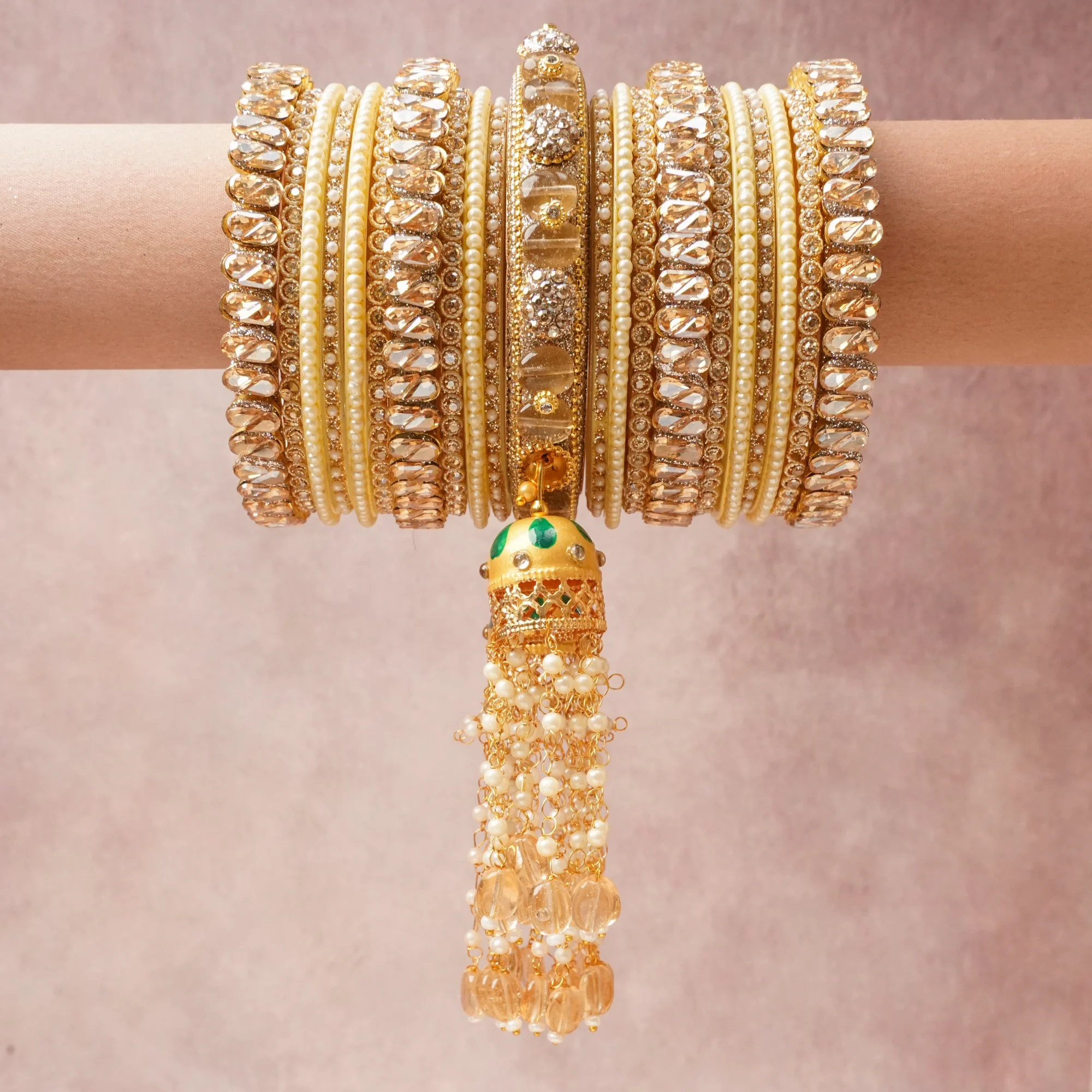 A majestic Champagne Gold set, complemented by Clear Crystal, Ivory Pearl, Emerald Green featuring Gold-toned Metal Alloy, Champagne Faceted Crystals, Clear Faceted Crystals, Simulated Pearls, Enamel.
Rich, ceremonial, and designed to be passed through generations.